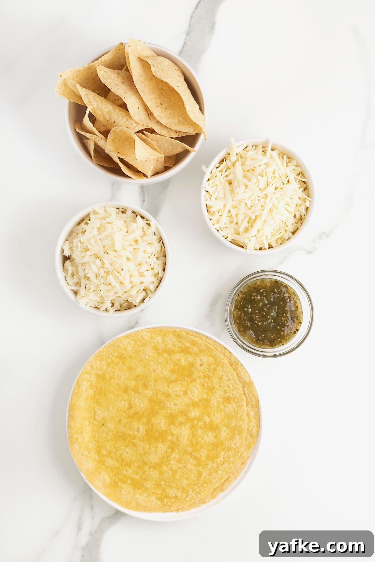 Skillet Queso Fundido: Gooey Melted Cheese Dip Recipe 5 Ingredients for skillet queso fundido on a marble countertop