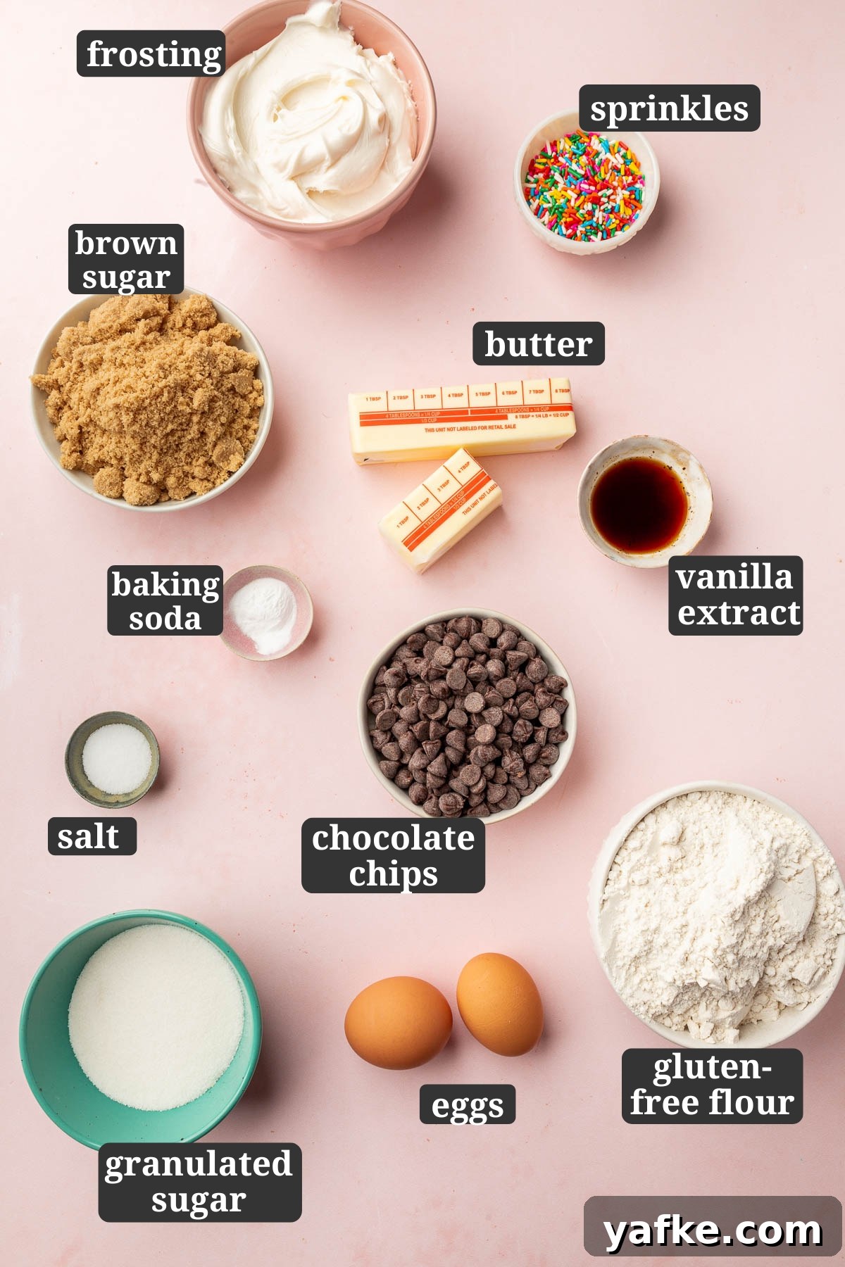 Gluten-Free Chocolate Chip Cookie Cups Recipe 2 Ingredients in small bowls to make gluten-free cookie cups, including frosting, sprinkles, sugars, butter, flour, eggs and chocolate chips.