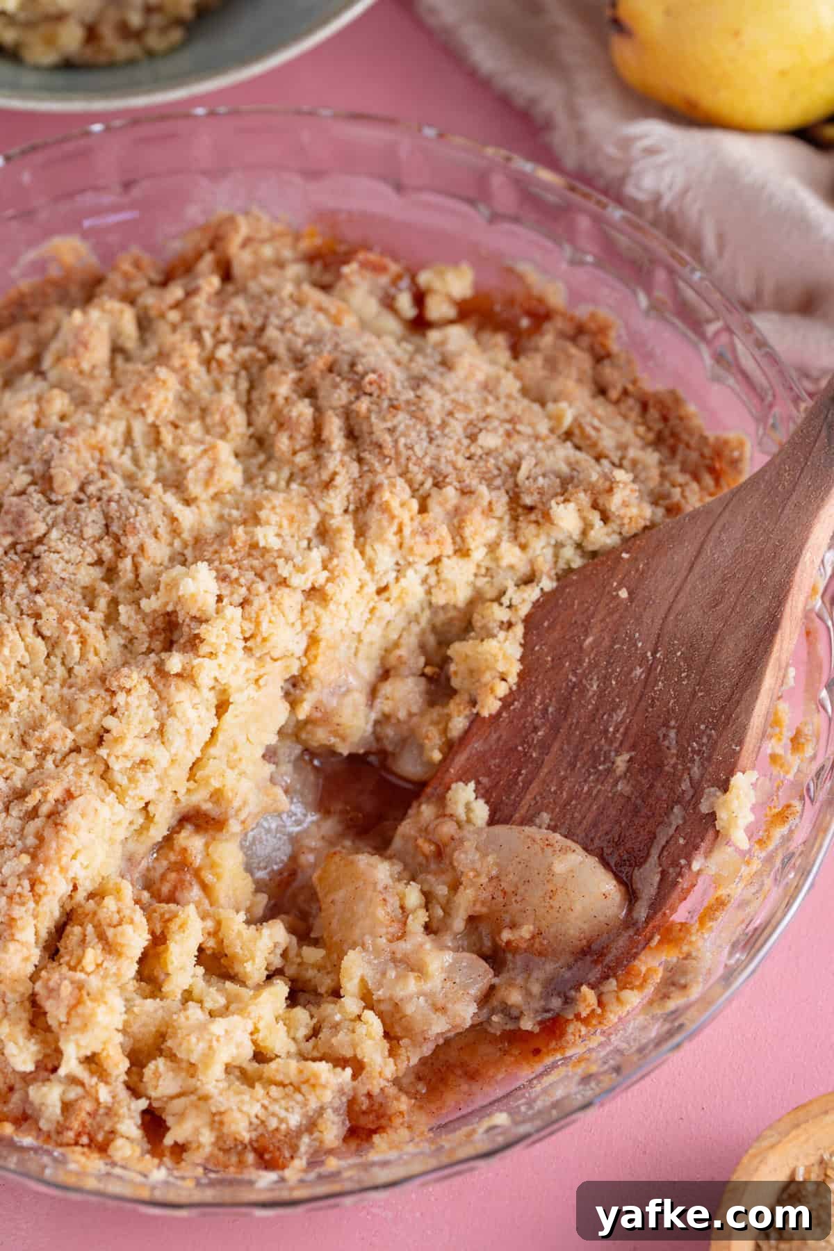 Gluten-Free Pear Crumble Recipe with Cinnamon Streusel 2 A dish filled with gluten free pear crumble.