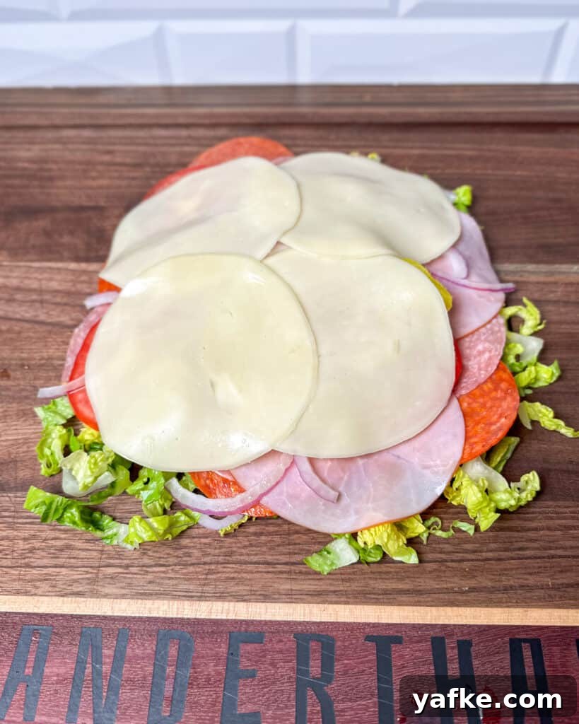 Viral Chopped Italian Sandwich Recipe: How to Make It 5 Ingredients piled on cutting board