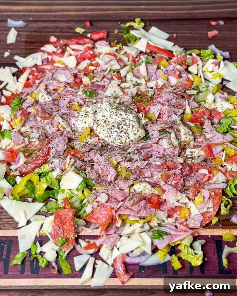 Viral Chopped Italian Sandwich Recipe: How to Make It 7 Dressing added to chopped mixture