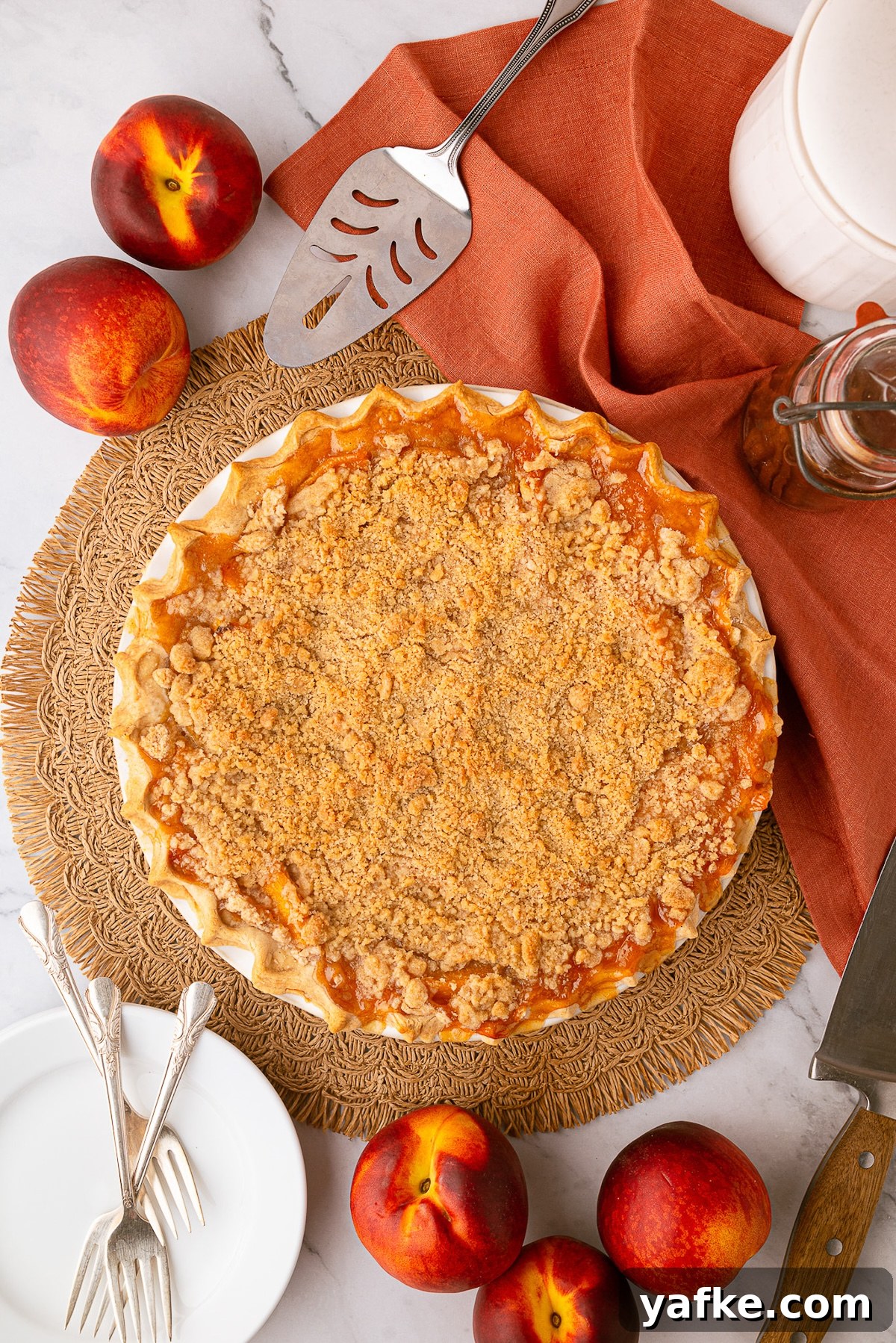 Classic Peach Crumble Pie with Brown Sugar Streusel 12 A freshly baked deep-dish peach pie made with frozen peaches, cooling for a perfectly set fruit filling.