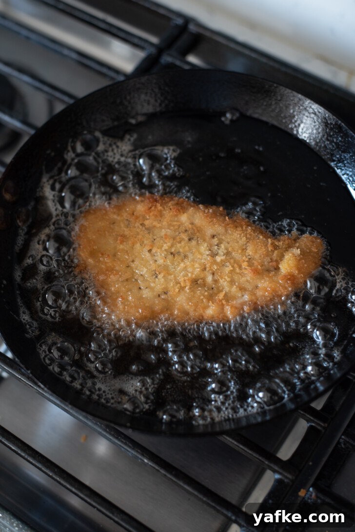 How to Make Crispy Japanese Tonkatsu in 30 Minutes 11 Crispy pork cutlet sizzling in hot frying oil
