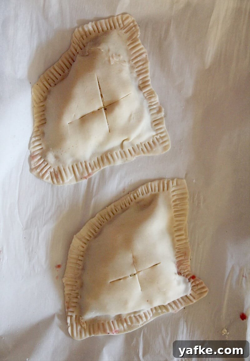 Turn Leftover Turkey into Cranberry and Boursin Hand Pies 4 View of leftover turkey hand pies sealed and ready to bake.