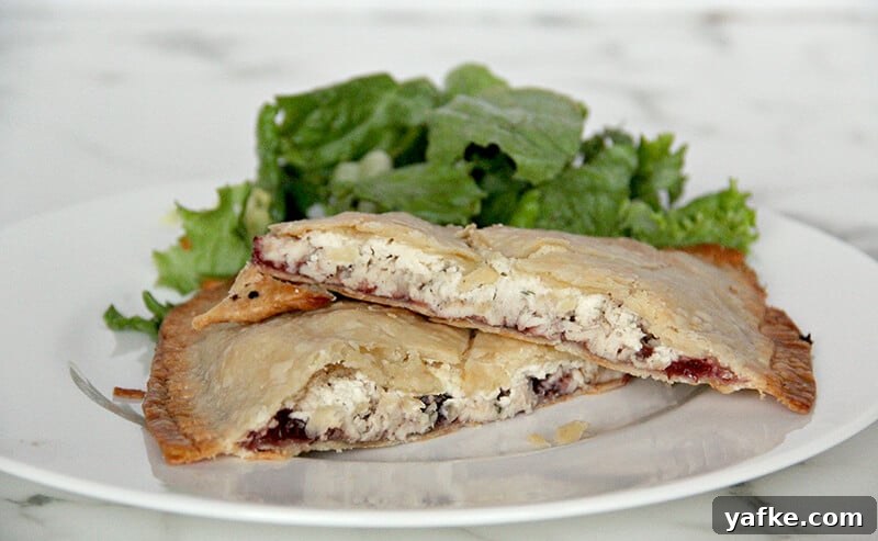 Turn Leftover Turkey into Cranberry and Boursin Hand Pies 6 Side view of the inside of the baked leftover turkey hand pies.