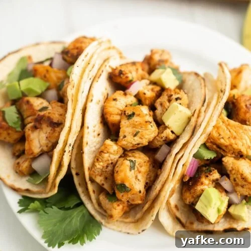 Low-Carb Chicken Recipes for Your Blackstone Griddle 15 Grilled chicken tacos with avocado and cilantro on soft flour tortillas.