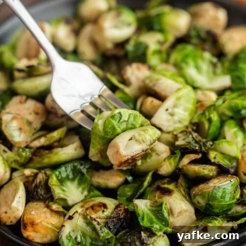 Low-Carb Chicken Recipes for Your Blackstone Griddle 18 A close-up of Blackstone Brussels sprouts on a plate