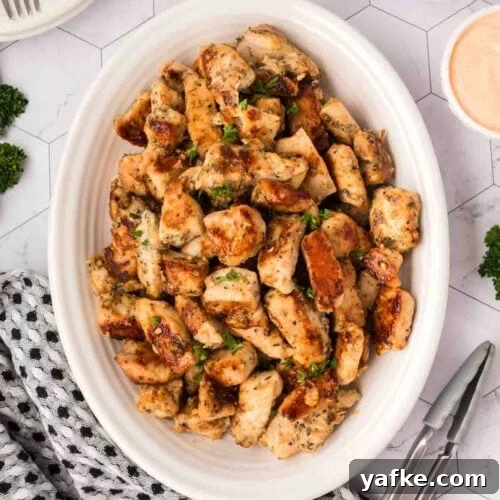 Low-Carb Chicken Recipes for Your Blackstone Griddle 5 Chicken bites in a white serving dish.