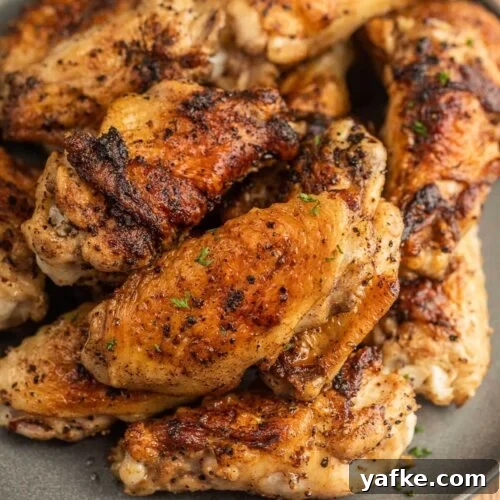 Low-Carb Chicken Recipes for Your Blackstone Griddle 7 Grilled chicken wings on a plate.
