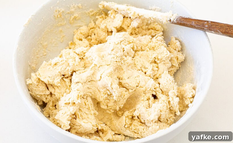 Jalapeno bagel dough in a white mixing bowl.